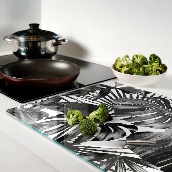 Szklana deska kuchenna z motywem tropikalnych liści w czerni i bieli