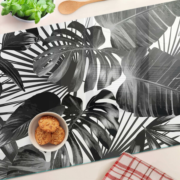 Szklana deska kuchenna z motywem tropikalnych liści w czerni i bieli