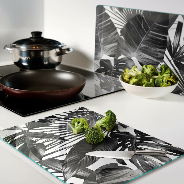 Szklana deska kuchenna z motywem tropikalnych liści w czerni i bieli