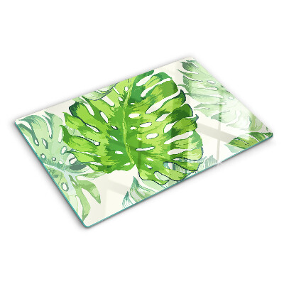 Deska kuchenna szklana z motywem liści monstery na jasnym tle