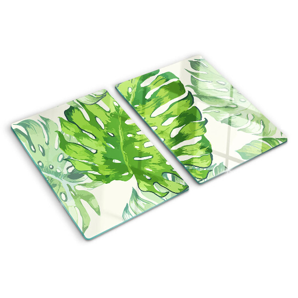 Deska kuchenna szklana z motywem liści monstery na jasnym tle