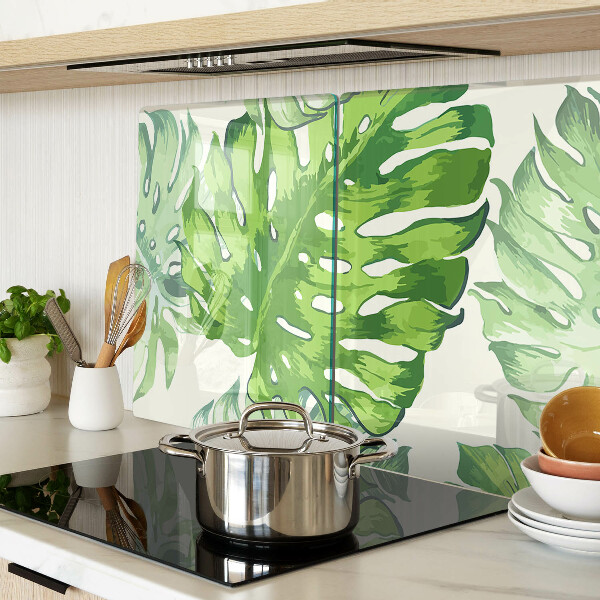 Deska kuchenna szklana z motywem liści monstery na jasnym tle