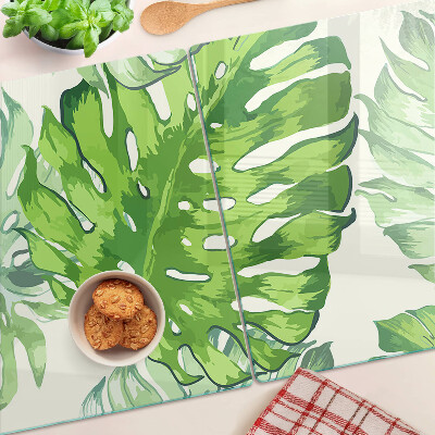 Deska kuchenna szklana z motywem liści monstery na jasnym tle