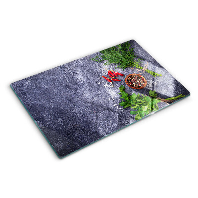 Deska kuchenna szklana z motywem ziół i przypraw na tle kamienia