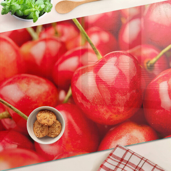 Szklana deska do krojenia z motywem wiśni na czerwonym tle