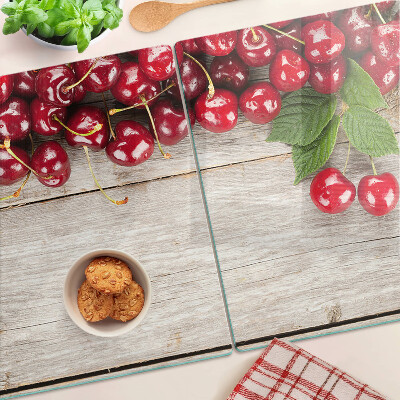 Szklana deska kuchenna z motywem wiśni na drewnianym tle