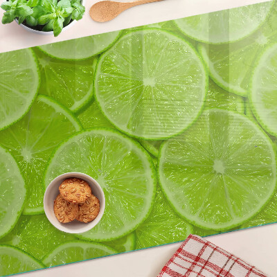 Szklana deska kuchenna z nadrukiem plastrów limonki na zielonym tle