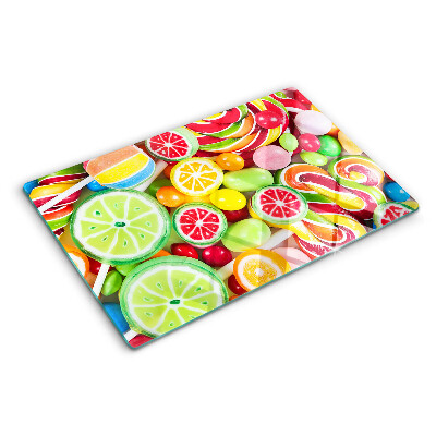 Deska kuchenna szklana z dekoracją ze słodkich cukierków i owoców
