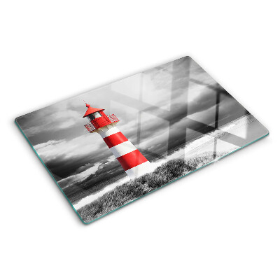 Szklana deska kuchenna z motywem latarni morskiej na tle pejzażu