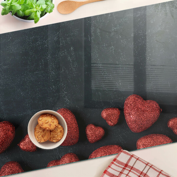 Deska kuchenna szklana z motywem czerwonych serc na ciemnym tle