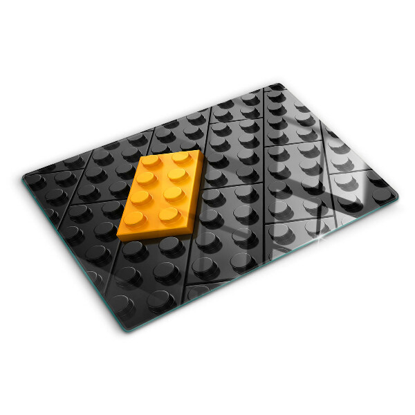 Szklana deska do krojenia z motywem klocków LEGO na czarnym tle