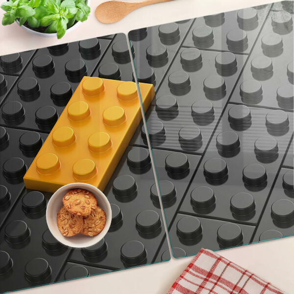 Szklana deska do krojenia z motywem klocków LEGO na czarnym tle