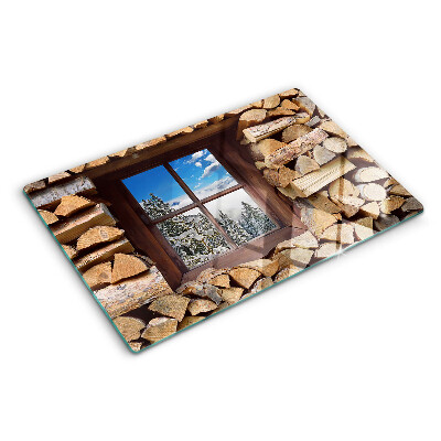 Szklana deska do krojenia z motywem zimowego krajobrazu widzianego przez okno