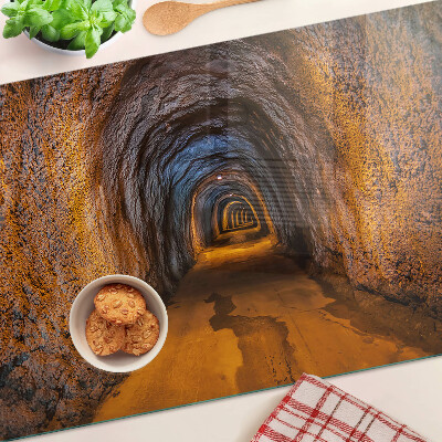 Szklana deska kuchenna z nadrukiem przedstawiającym tunel w jaskini z oświetleniem