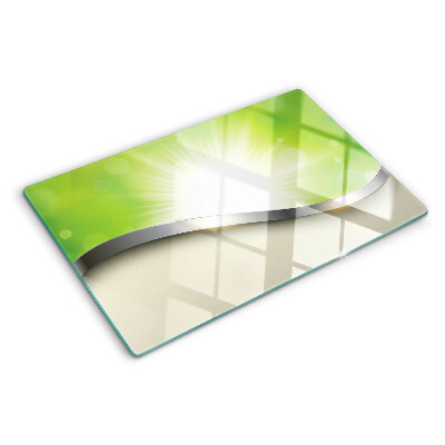 Deska kuchenna szklana z motywem zielonego bokeh z promieniami światła