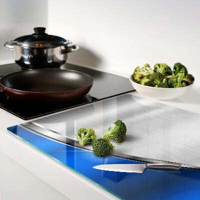 Szklana deska kuchenna z metalicznym wzorem i niebieskimi akcentami