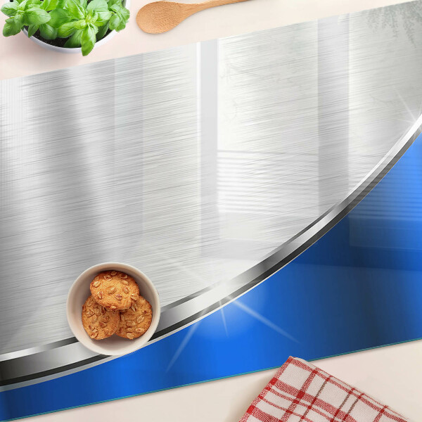Szklana deska kuchenna z metalicznym wzorem i niebieskimi akcentami
