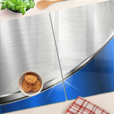 Szklana deska kuchenna z metalicznym wzorem i niebieskimi akcentami