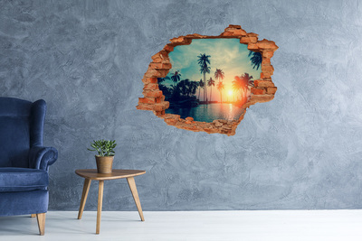 Dziura 3d w ścianie naklejka Zachód słońca palmy