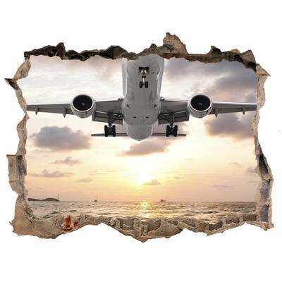 Foto zdjęcie dziura na ścianę Samolot nad morzem