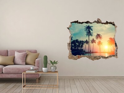 Dziura 3d w ścianie naklejka Zachód słońca palmy
