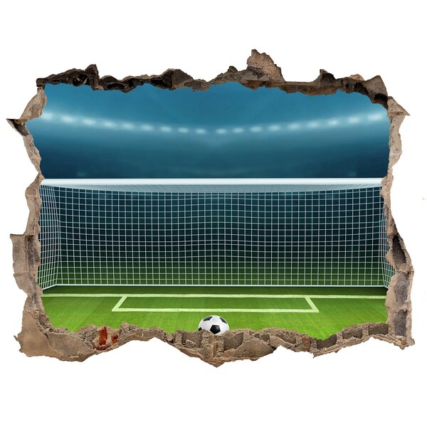 Fototapeta dziura na ścianę 3d naklejka Stadion piłkarski za dziurą w ścianie