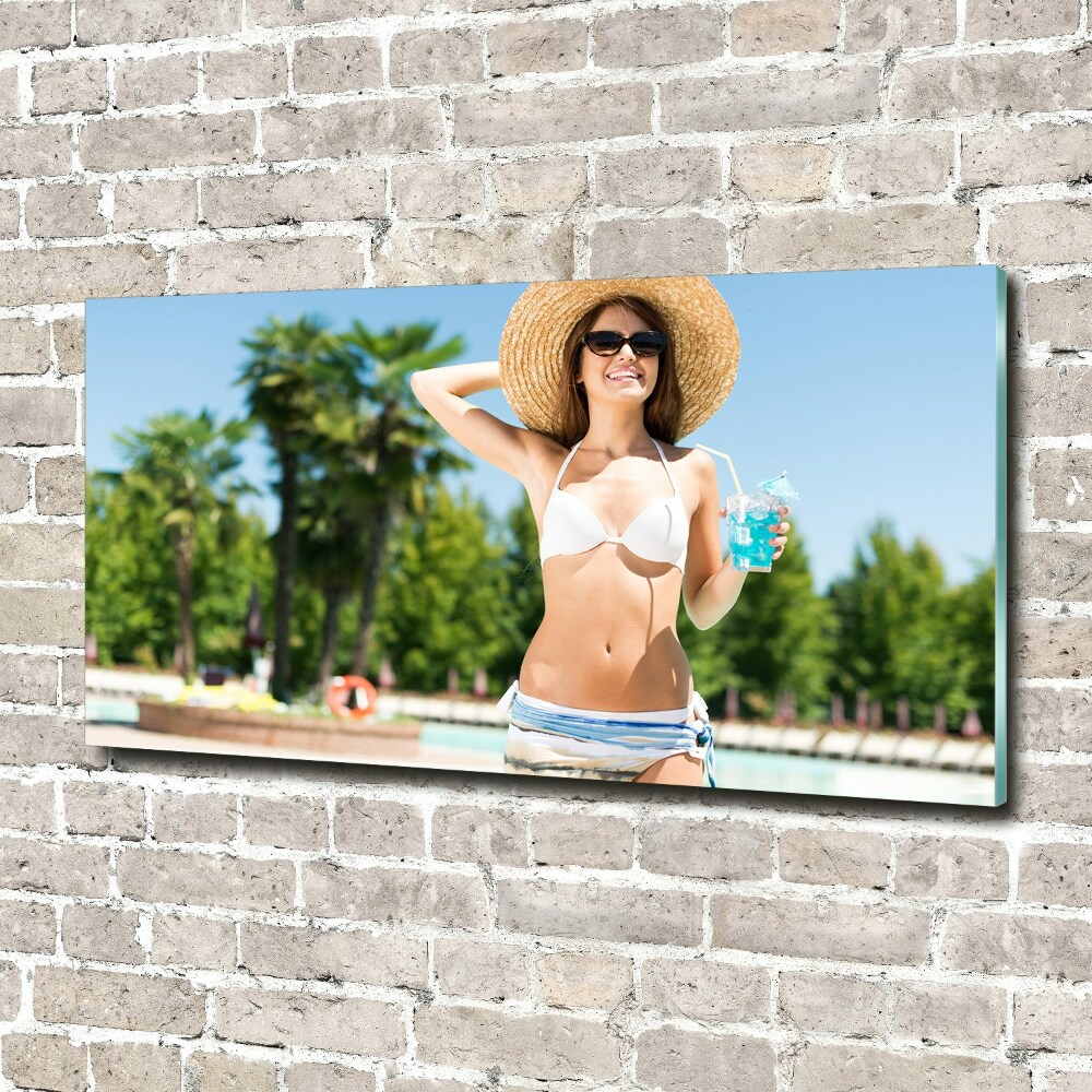 Foto obraz akryl Kobieta nad basenem
