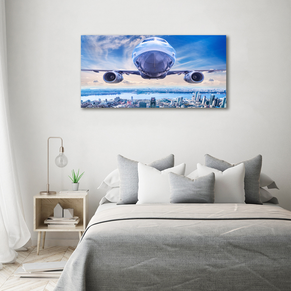 Foto obraz akryl Samolot nad miastem
