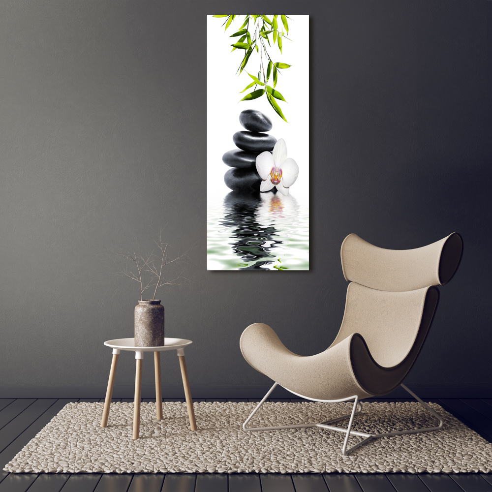 Foto obraz szkło akryl pionowy Orchidea i kamienie