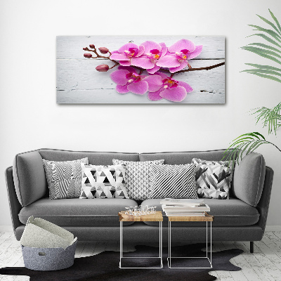 Foto obraz na płótnie Orchidea na drewnie