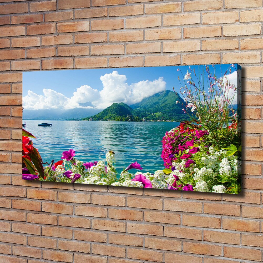 Foto obraz na płótnie Kwiaty nad jeziorem