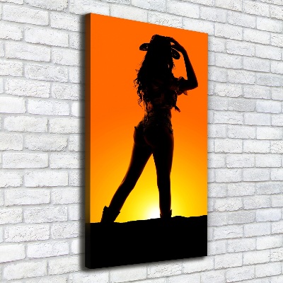 Foto obraz na płótnie pionowy Sylwetka kowbojki