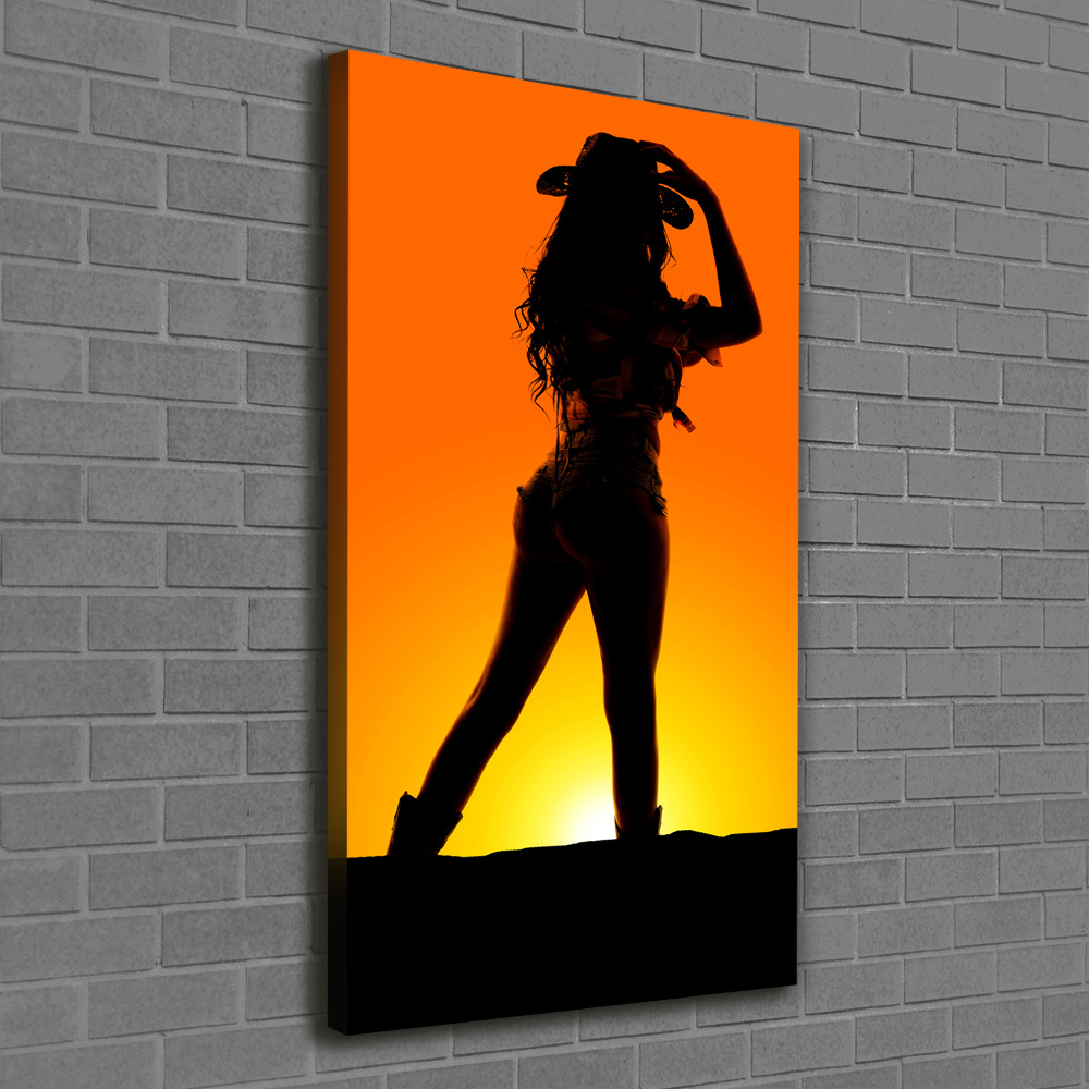 Foto obraz na płótnie pionowy Sylwetka kowbojki
