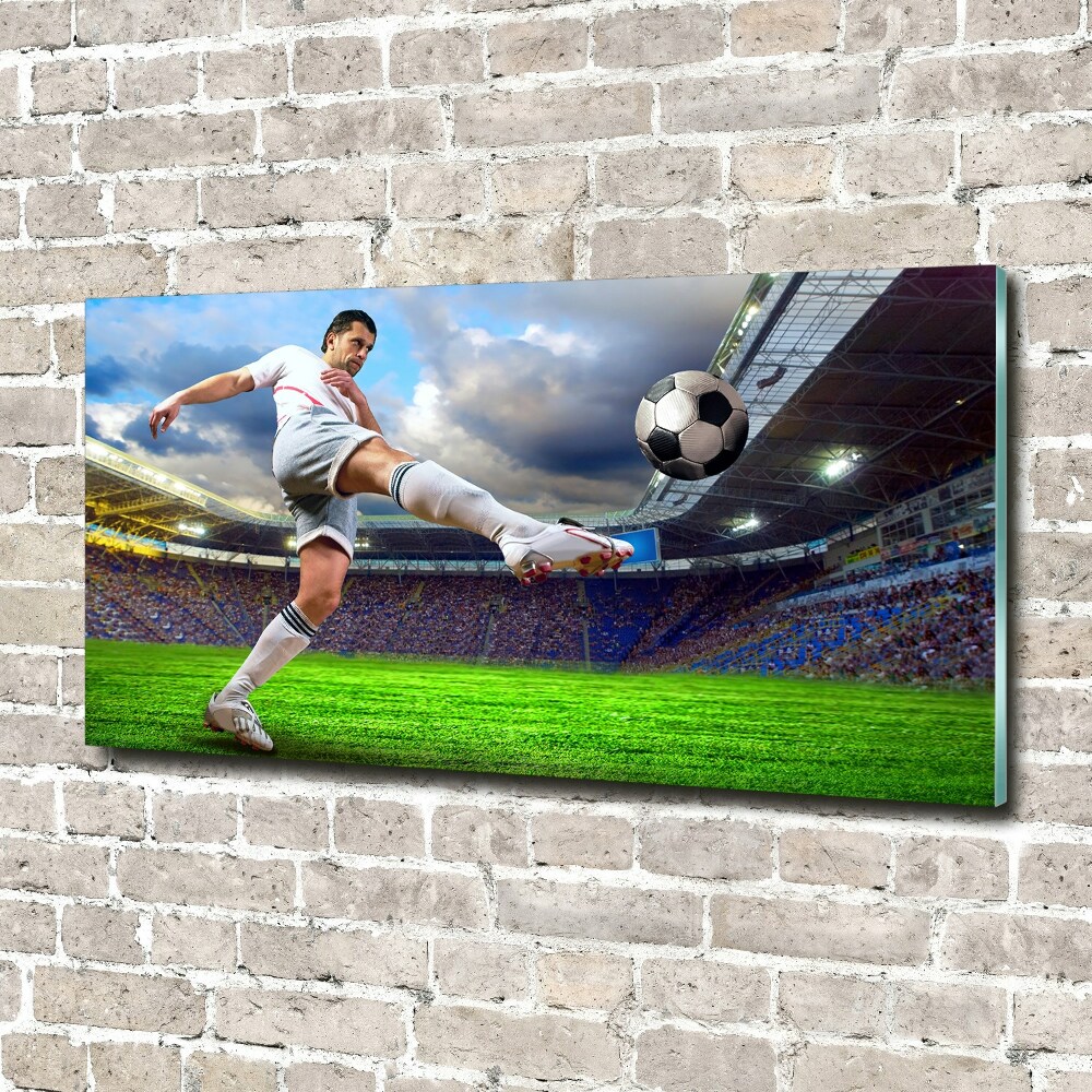 Foto obraz szklany Piłkarz na stadionie