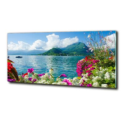 Foto obraz szklany Kwiaty nad jeziorem