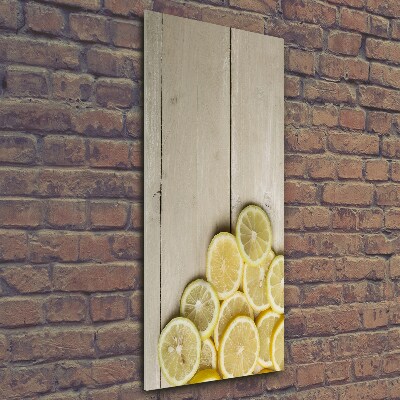 Foto obraz na szkle pionowy Cytryny na drewnie