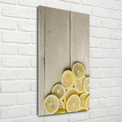 Foto obraz na szkle pionowy Cytryny na drewnie